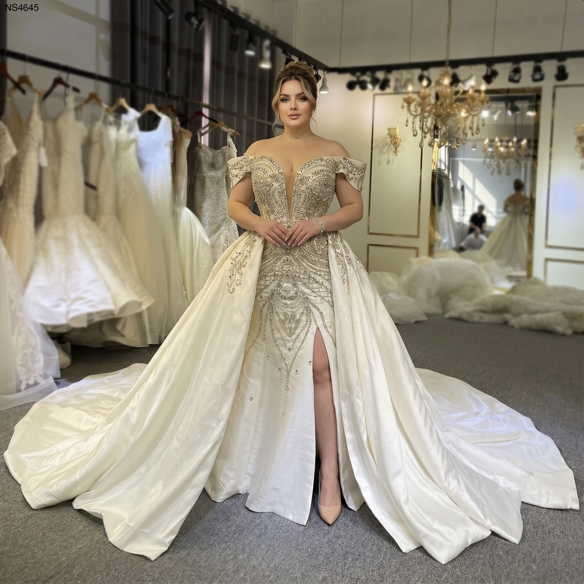 Plus-size bride wearing a luxury Mikado satin trumpet wedding gown featuring a deep V-neckline, silver crystal beading, and a voluminous detachable ball gown overskirt.