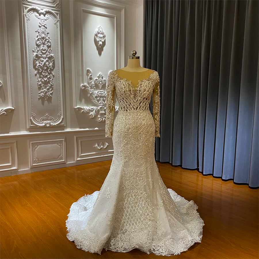 African-style mermaid wedding dress displayed on a mannequin, showing the front silhouette and intricate beadwork.