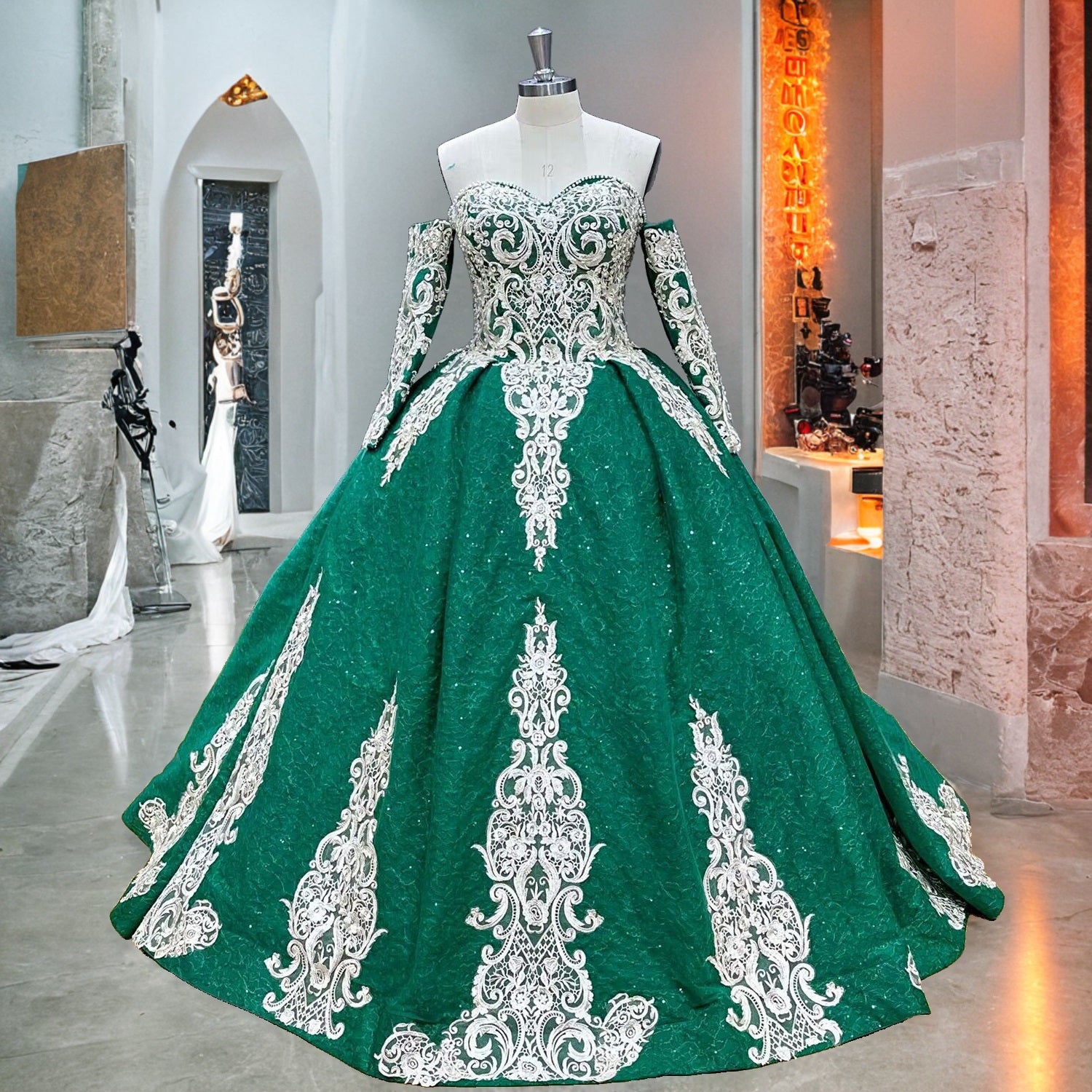Showroom display of a green quinceanera dress on a mannequin highlighting its sweetheart neckline and matching detached long embroidered sleeves.