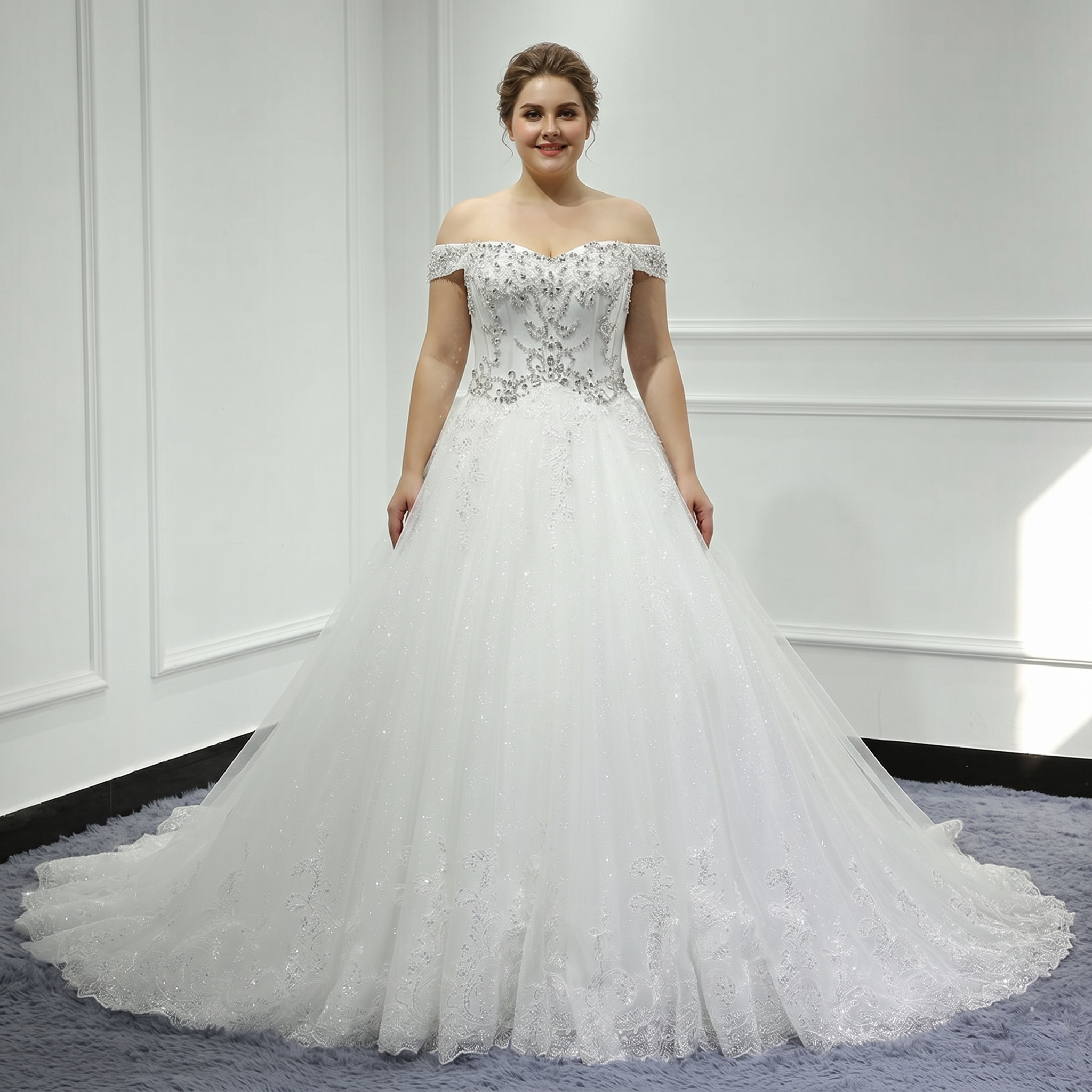 A close-up view of a bride wearing a white off-the-shoulder wedding gown featuring intricate crystal beading and sequin embellishments on the bodice.