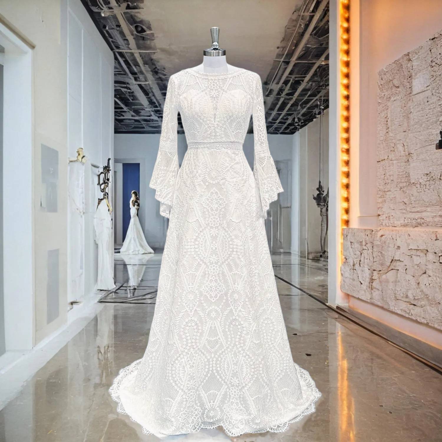 Professional bridal showroom display of an ivory lace wedding dress with a see-through waist and unique flared long sleeves under soft lighting.