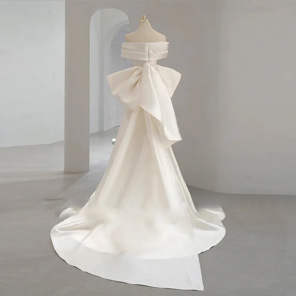 Mannequin view of a simple, modern off-the-shoulder mermaid wedding dress with a flattering sweetheart neckline and short sleeves.