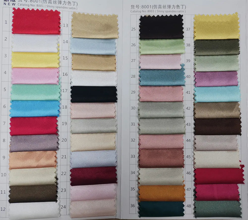 Multi-color numbered textile catalog chart displaying premium satin and stretch fabric swatch variations for custom order bridal attire.