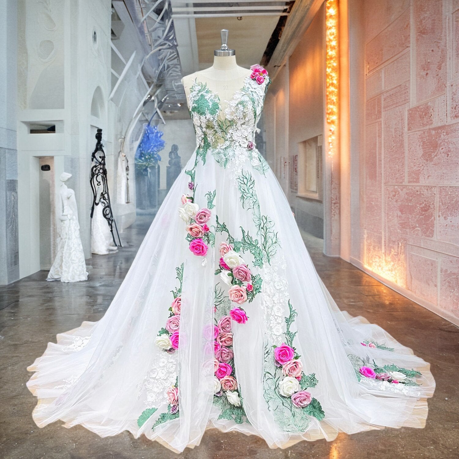 Full front view of a pastoral ball gown wedding dress on a mannequin in a studio hallway, highlighting the beautiful handmade floral appliques and classic silhouette.