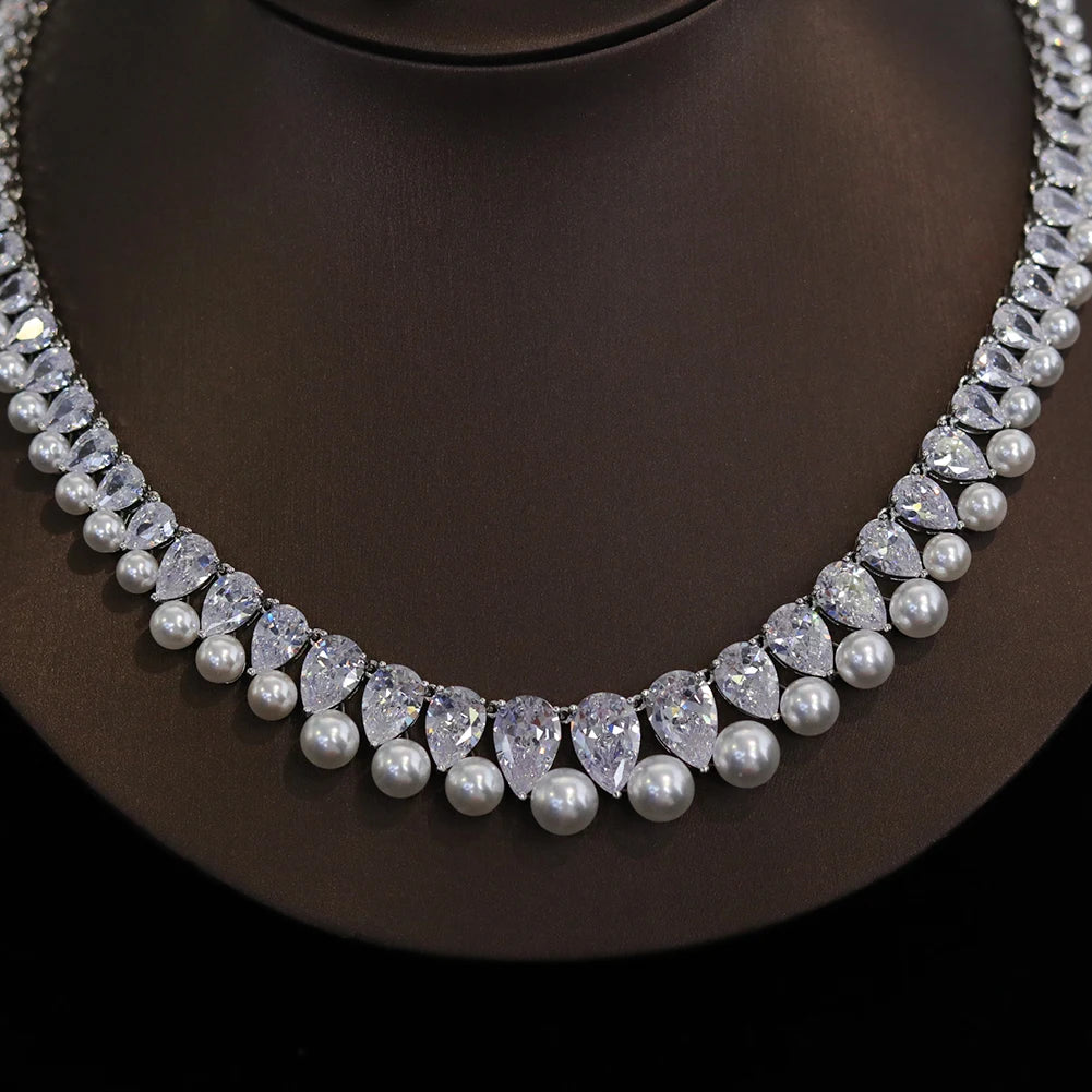 Detailed close-up macro view highlighting the alternating teardrop cubic zirconia gems and round white pearls on a bridal choker.