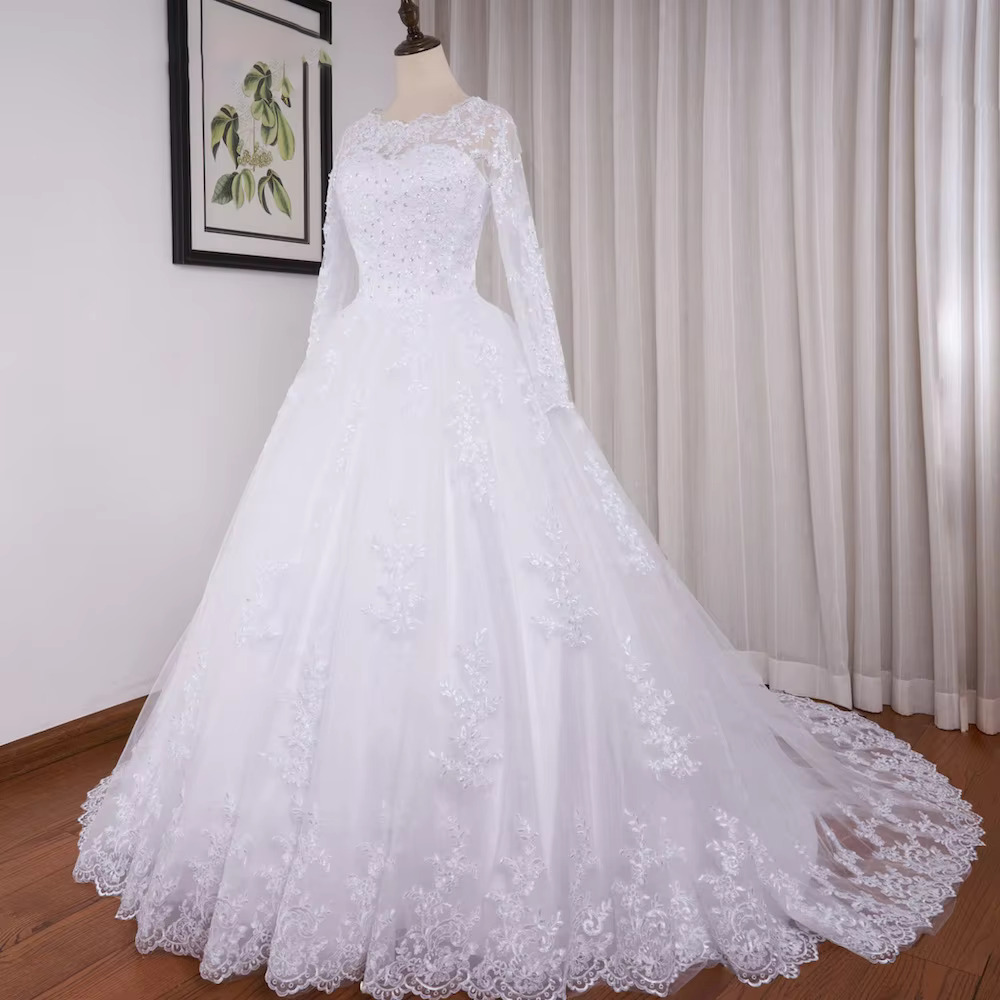 Front view of the long sleeve plus size wedding dress, rendered in a romantic soft blush pink variation option for alternative fairytale bridal styling.