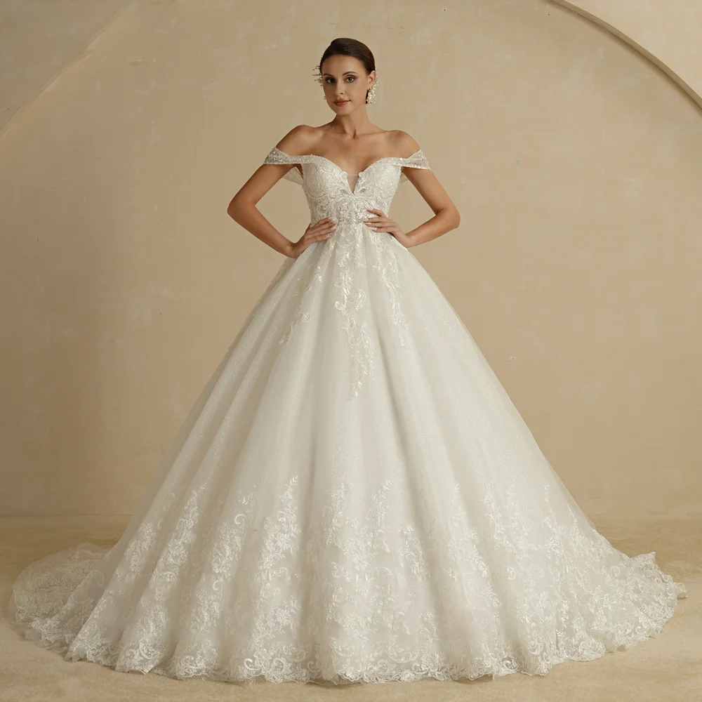 Front view of a sleeveless, vintage-style bridal ball gown with a sweetheart neckline and rich embroidery, designed for an elegant princess look.