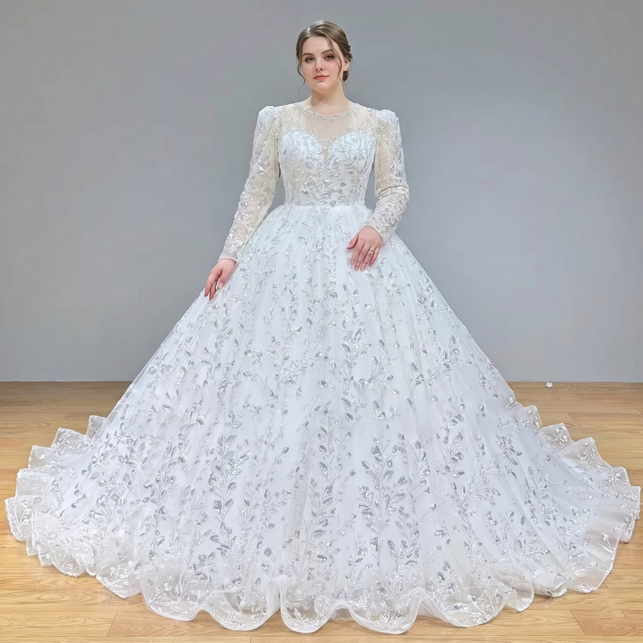 Rear view of the glitter robe de mariage, showcasing the traditional lace-up corset back design, a dropped baseline bodice, and a sweeping cathedral-length shimmering train.