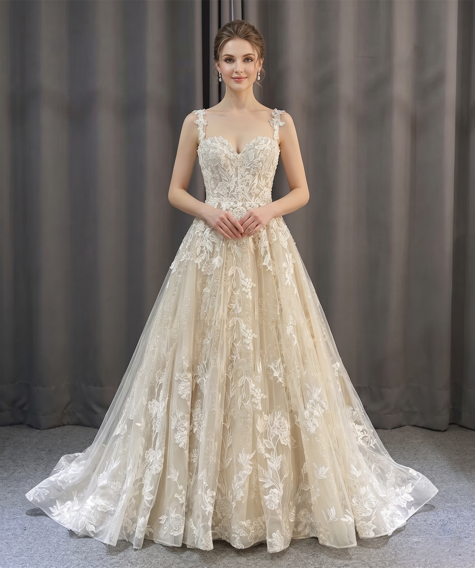 Front view of a romantic A-line beach style wedding dress with lace floral detailing on a model.