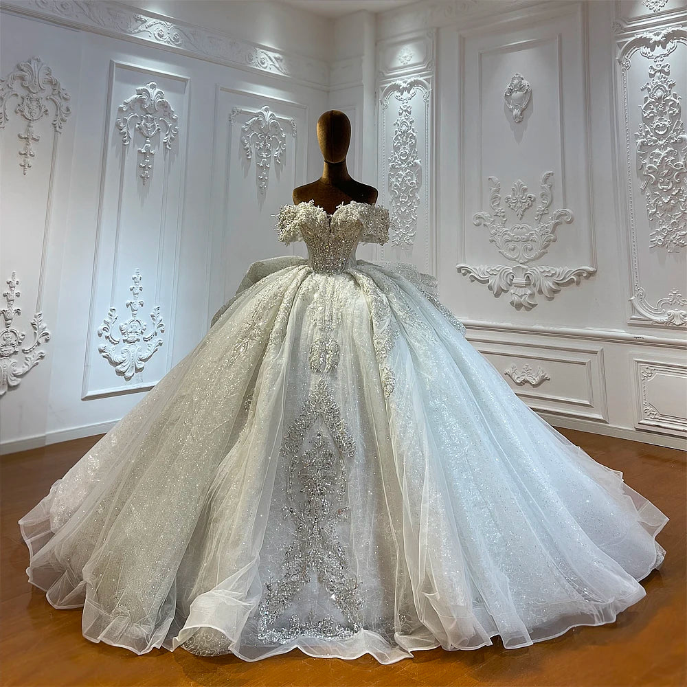 Luxury Off-Shoulder Beading Bridal Gown with Romantic Sleeves and Flowing Skirt