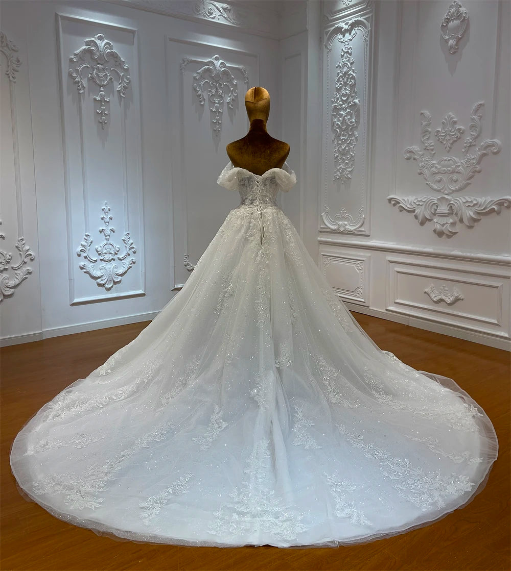 Elegant Beaded A-Line Wedding Dress with Delicate Embellishments and Flowing Skirt