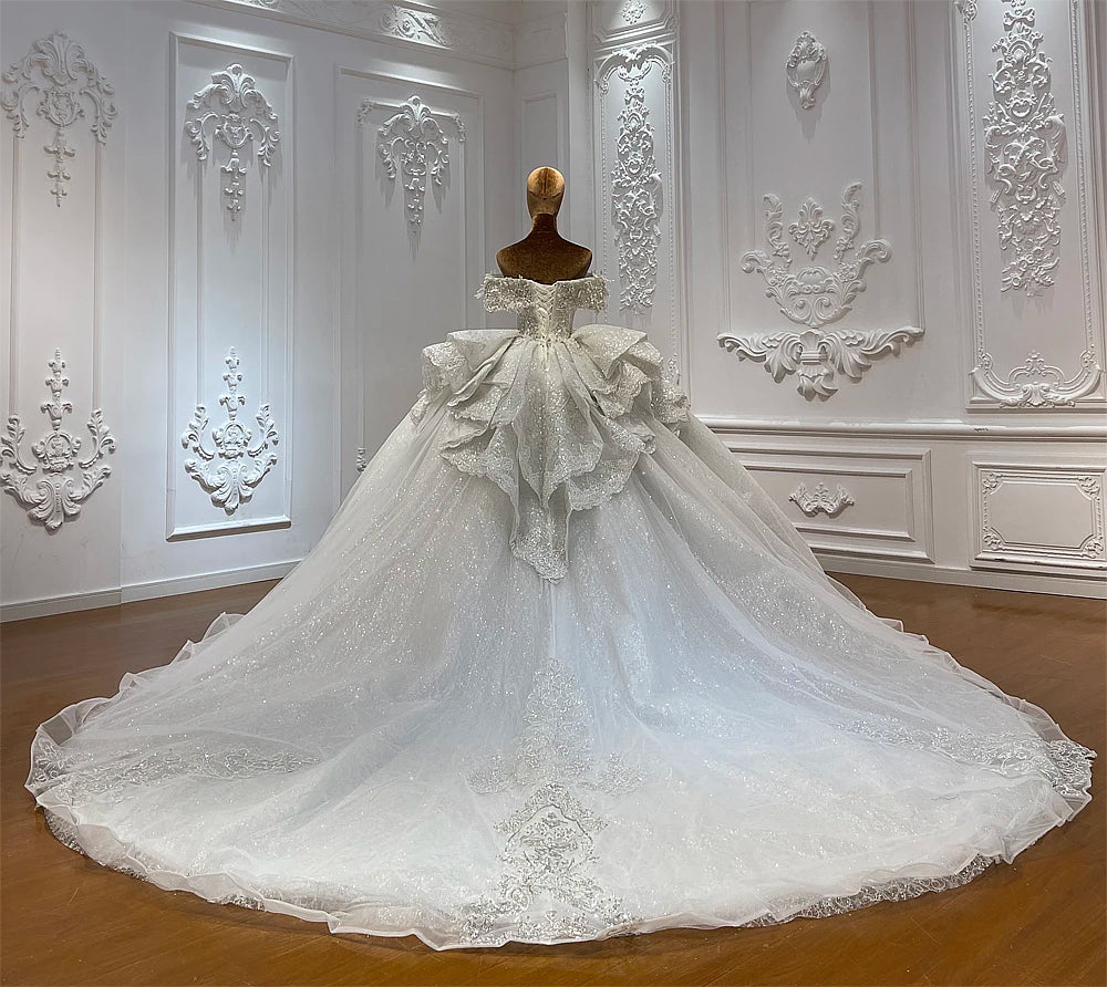 Luxury Off-Shoulder Beading Bridal Gown with Romantic Sleeves and Flowing Skirt