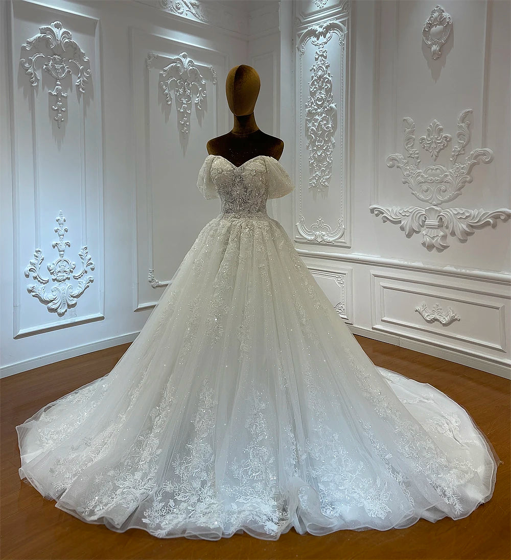 Elegant Beaded A-Line Wedding Dress with Delicate Embellishments and Flowing Skirt