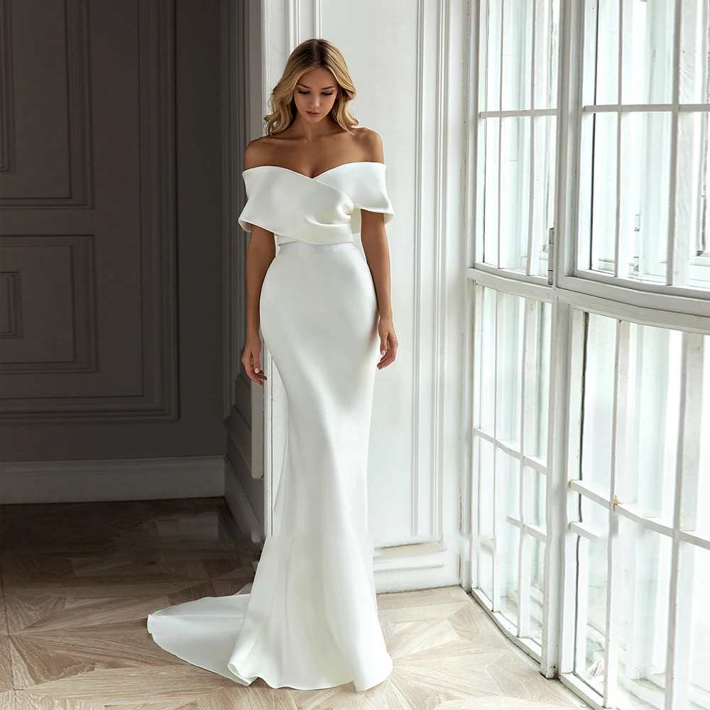 Clean-cut satin mermaid wedding gown without the overskirt, showcasing a form-fitting trumpet silhouette, tailored waist seams, and a floor-length pool train.