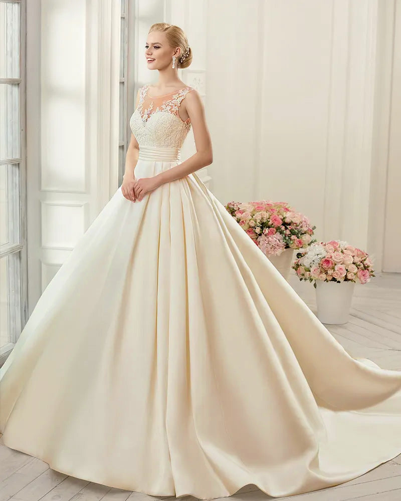 Front profile of a classic satin A-line bridal gown featuring a sweetheart neckline and simple, elegant lace bodice.