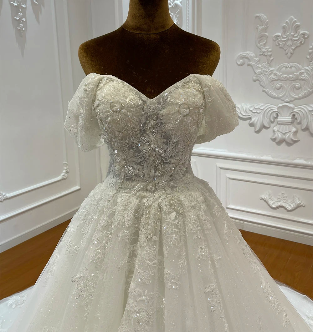 Elegant Beaded A-Line Wedding Dress with Delicate Embellishments and Flowing Skirt