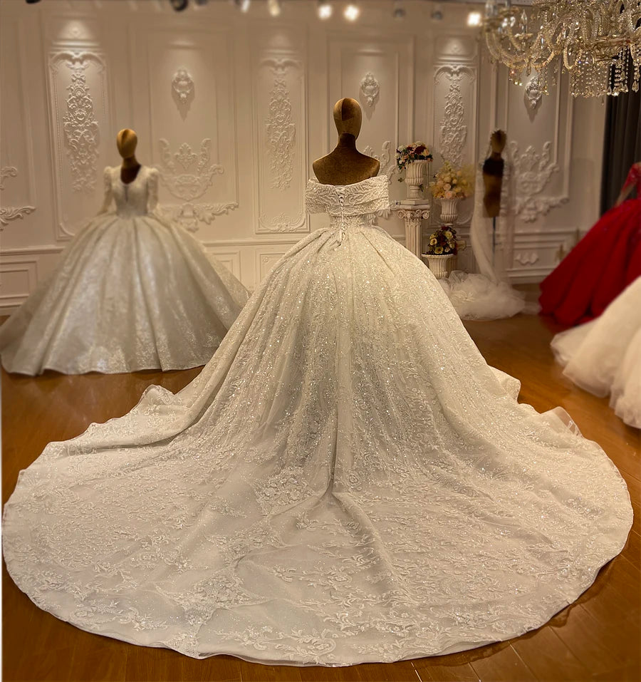 Luxury Off-the-Shoulder Wedding Dress with Pearl Embellishments and Elegant Train