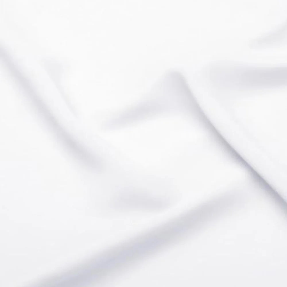 Soft close-up detail of smooth, high-quality white bridal satin fabric folds, showcasing the premium lining material used for custom luxury wedding dresses.