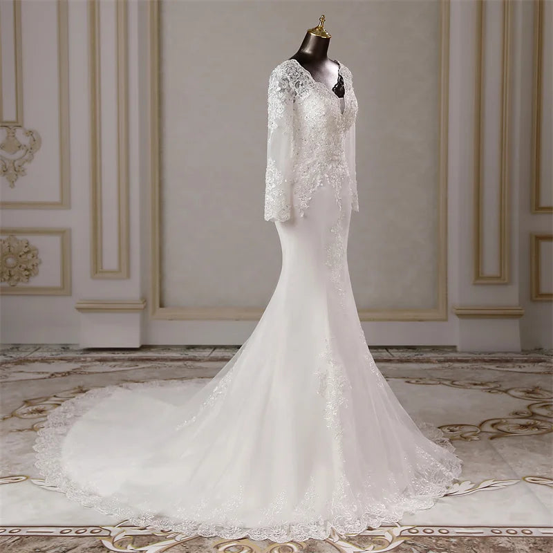 Mannequin presentation of the long-sleeved mermaid bridal gown, highlighting the balanced design of the lace bodice and sleeves.