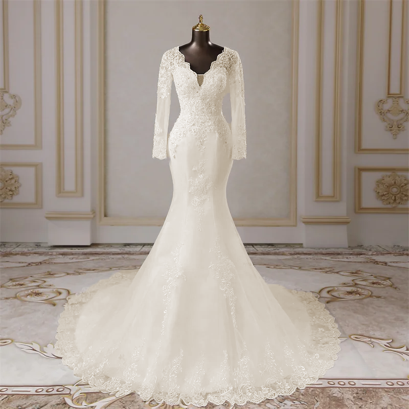 Rear view of the long-sleeved mermaid wedding dress on a mannequin, highlighting the detailed back design and flowing lace-trimmed train.