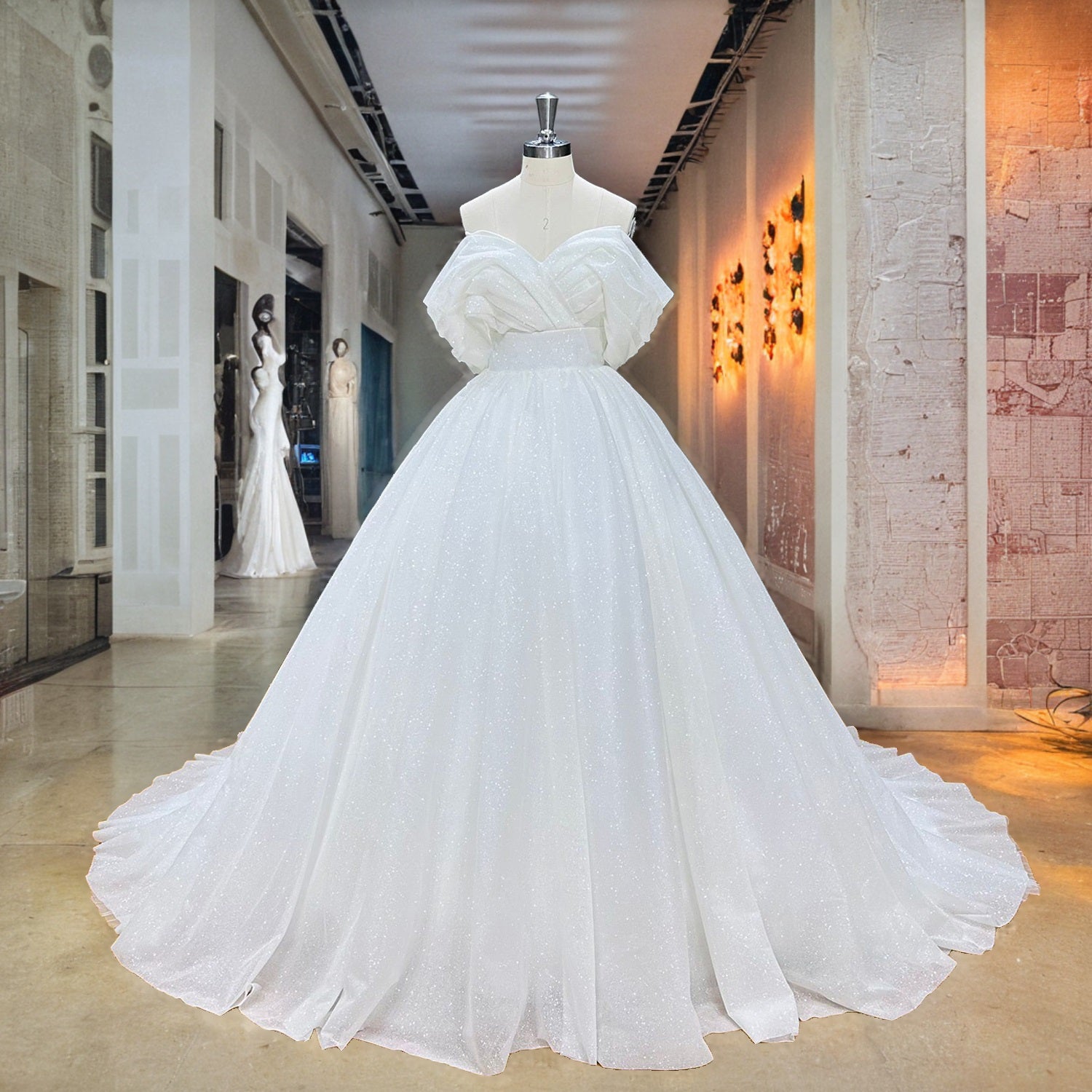 Elegant vintage V-neck bridal gown with a draped off-the-shoulder silhouette and shimmering fabric displayed on a boutique mannequin.