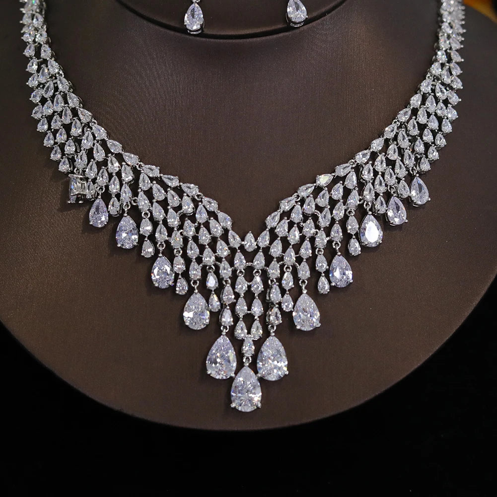 Detailed macro view of the intricate teardrop cluster centerpiece on a shiny cubic zirconia bridal necklace.