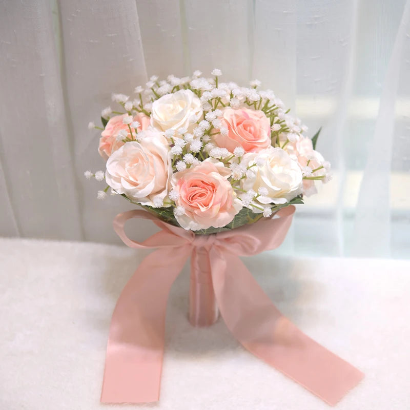 Close-up side profile of a bridal party silk peony rose wedding bouquet highlighting soft peach roses and white baby's breath.