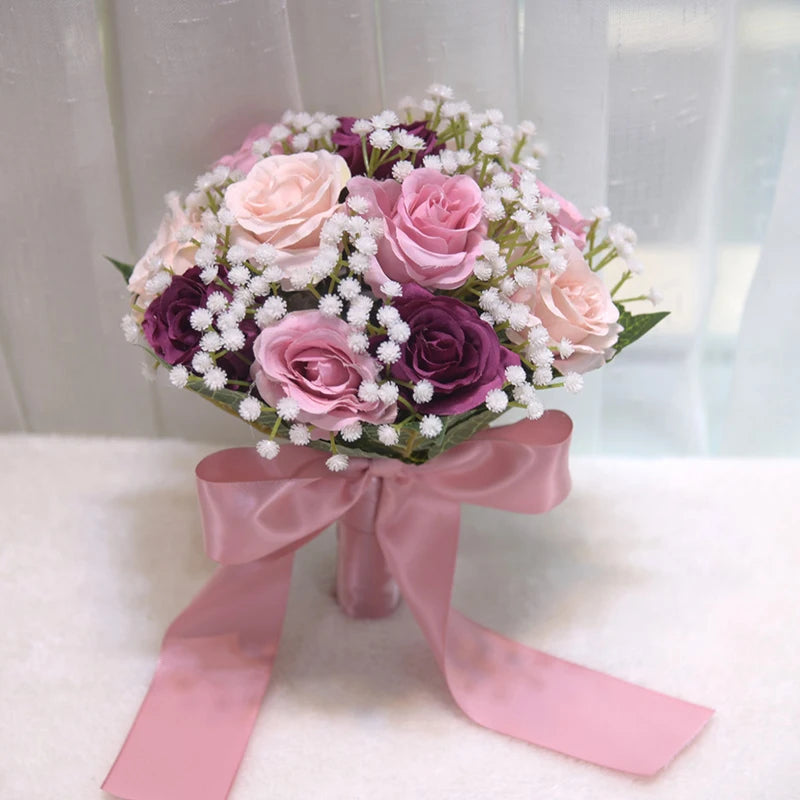 Dark purple and mauve silk peony rose wedding bouquet featuring dark magenta accent roses and a dusty pink satin ribbon.