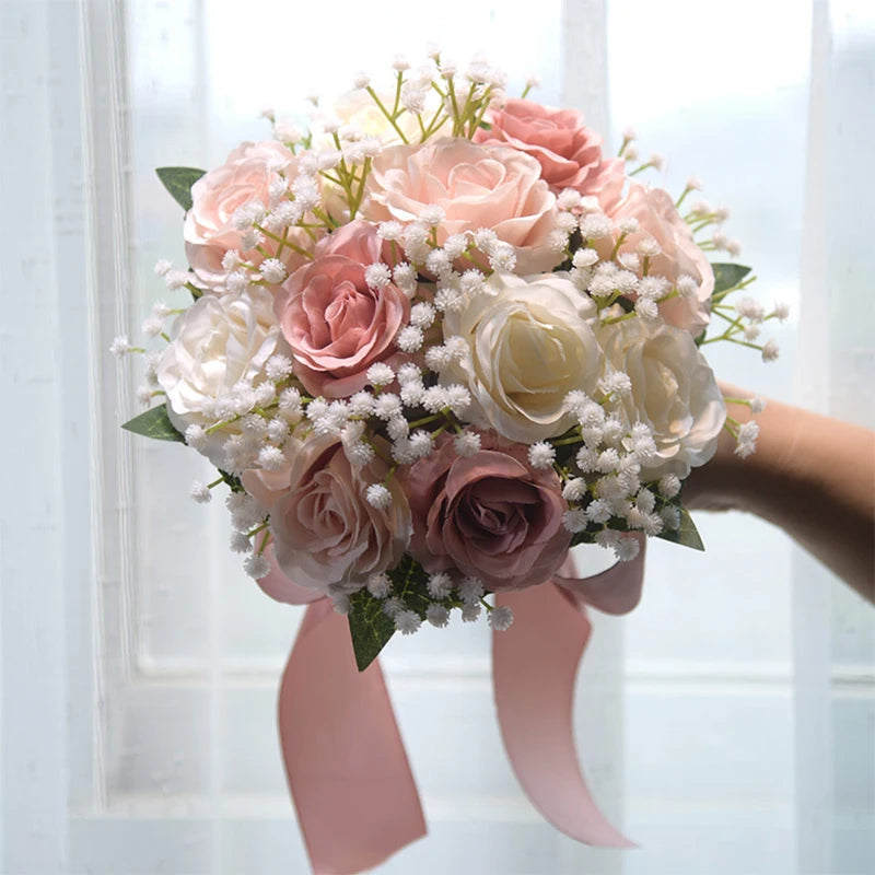 Handheld elegant wedding bouquet featuring vintage dusty rose and champagne silk peony flowers mixed with greenery.