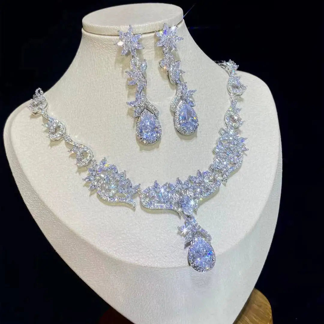 Side angle of a luxury cubic zirconia wedding jewelry set for women, highlighting marquise cuts and teardrop stones.