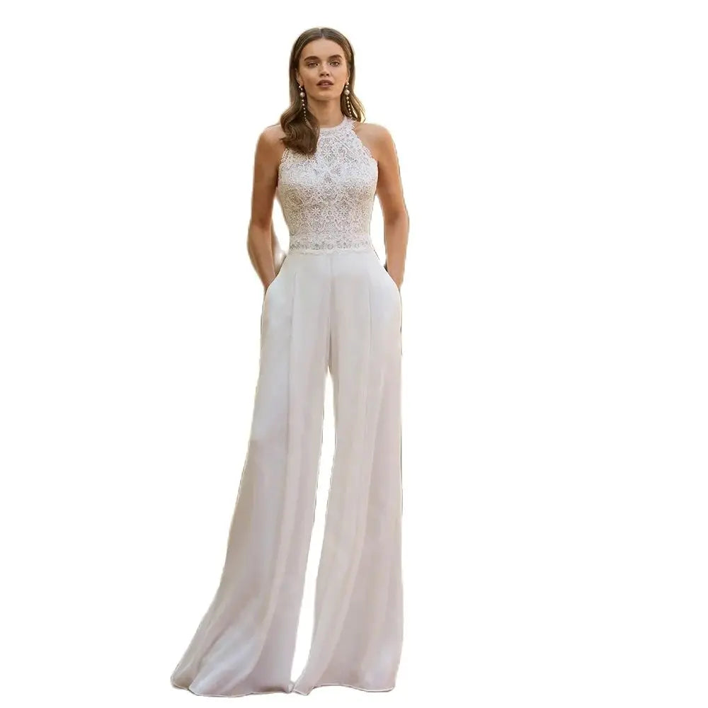 Isolated product silhouette on a solid white background displaying the clean lines of the sleeveless lace wedding jumpsuit dress with fluid wide-leg pants.