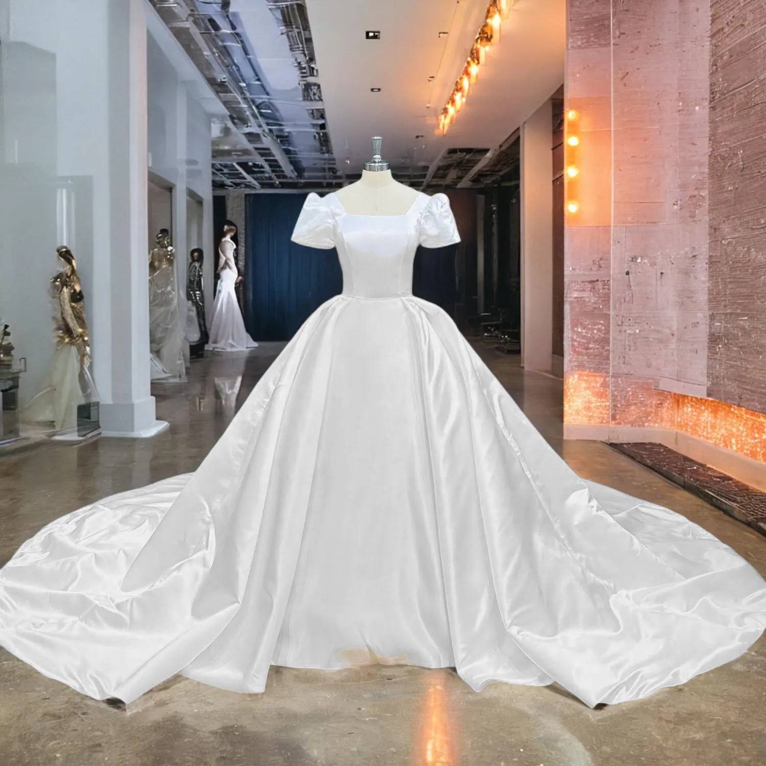 Wide showroom perspective of a magnificent satin ball gown with a long cathedral train, emphasizing the grand scale of the skirt and the clean, classic design.