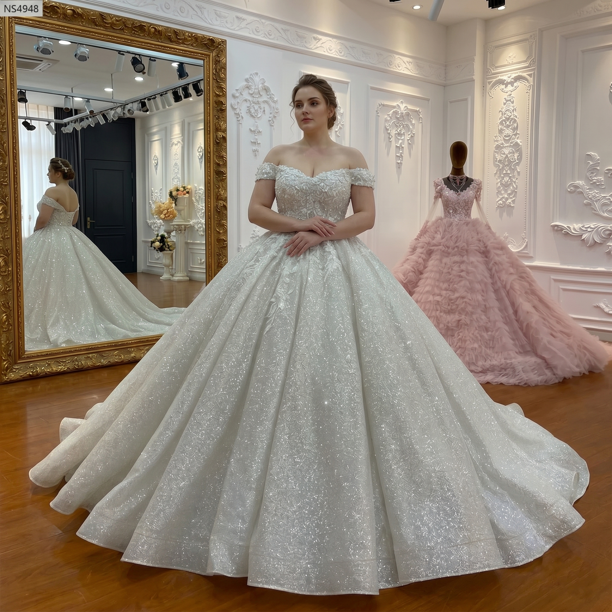 Plus-size model wearing an elegant sparkling strap wedding gown featuring a voluminous ball gown silhouette and 100cm train.