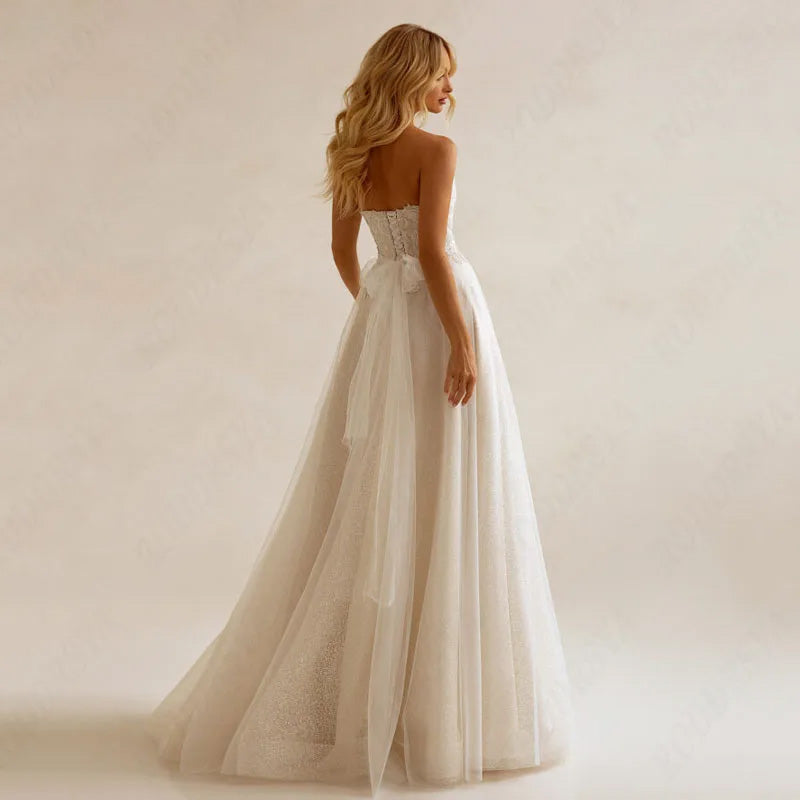 A bride posing in a full-sleeve A-line wedding dress with a long train, captured in an elegant interior.