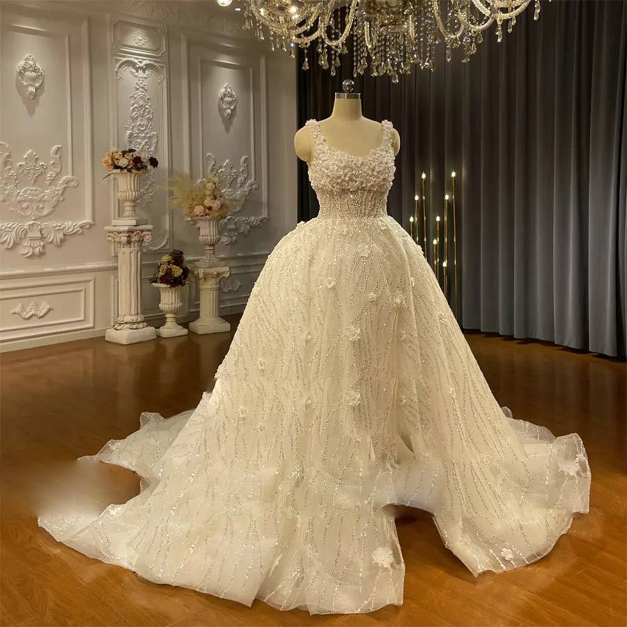 Full profile of an elegant strappy A-line bridal gown on a mannequin, perfect for a summer destination wedding.