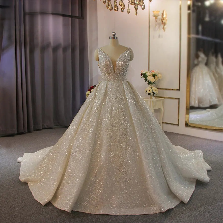 Professional mannequin display of the floor-length sleeveless ball gown, showcasing the expansive bell-shaped silhouette and all-over shimmering fabric.