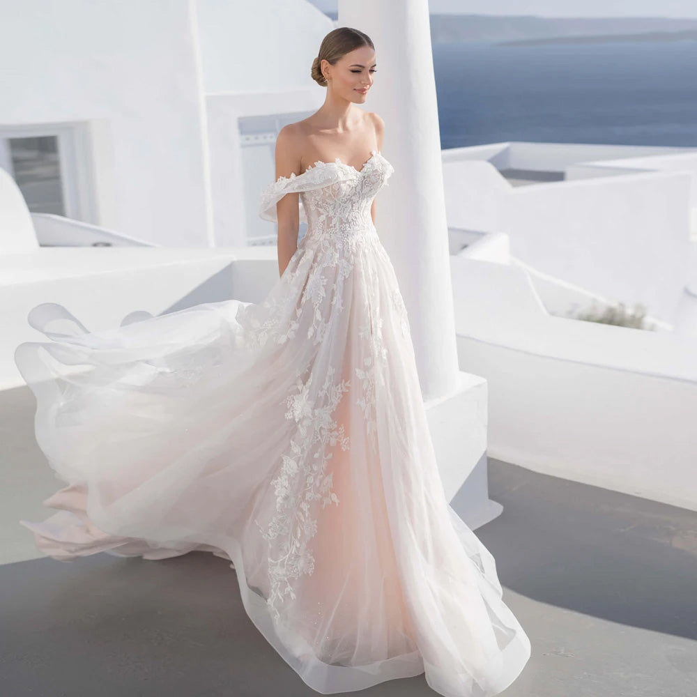 A side-view profile of a bride in a sweetheart lace A-line wedding dress, showcasing the intricate appliques, classic silhouette, and elegant court train.