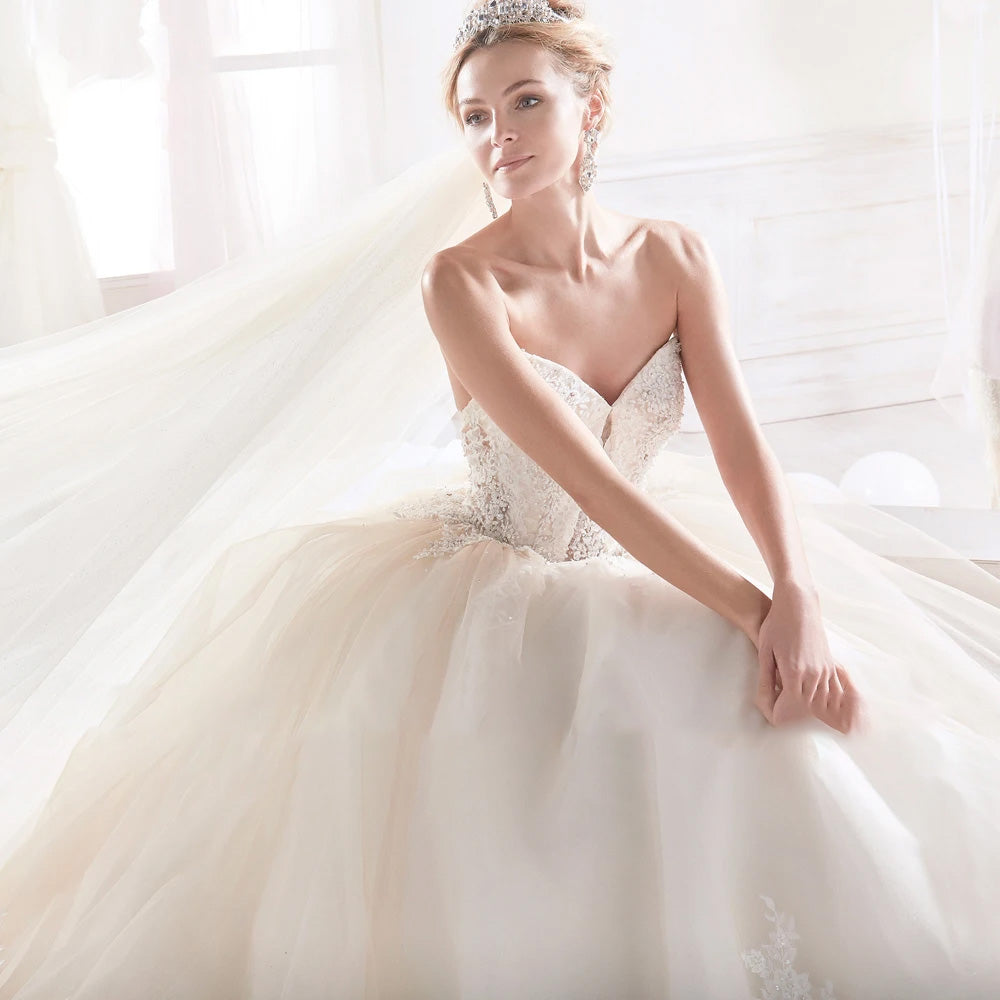 Sophisticated portrait of a bride wearing a sweetheart neck A-line gown with exquisite beaded bodice detailing.