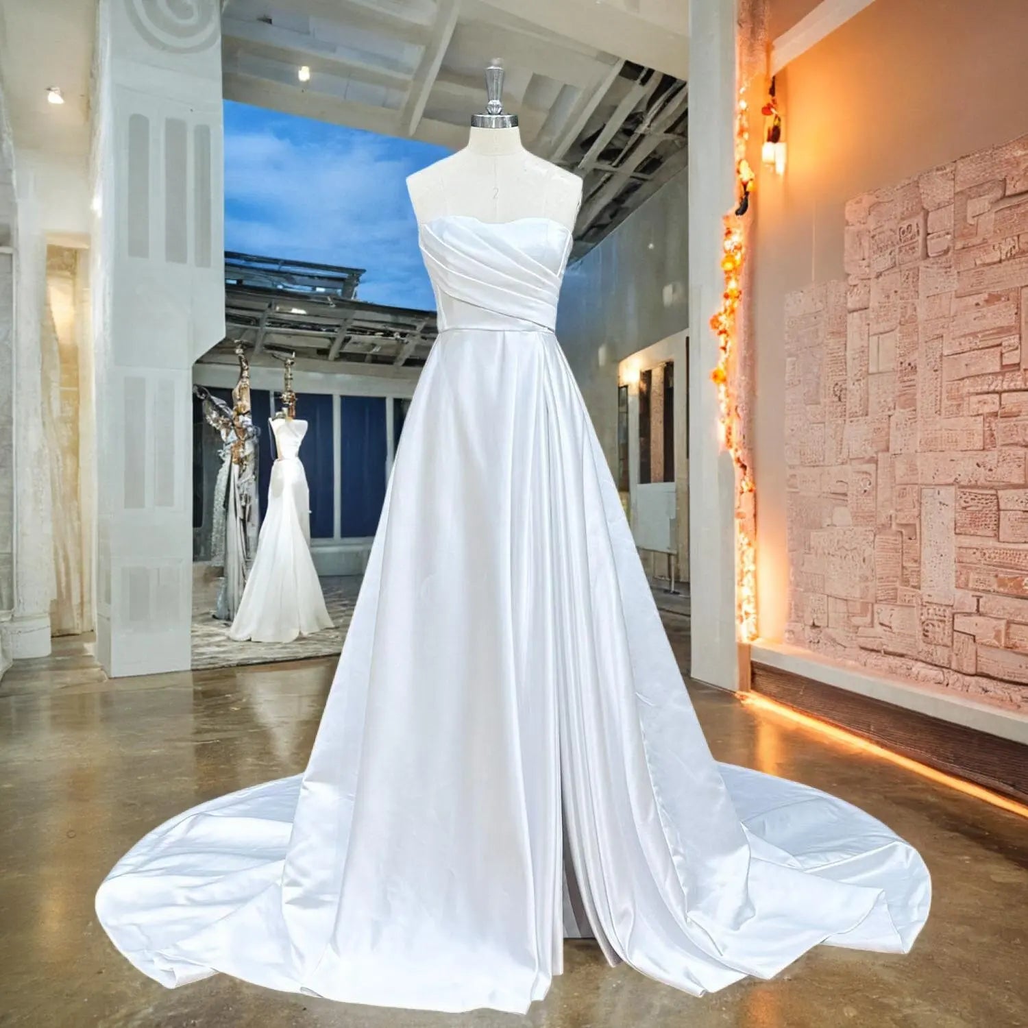 Front view of a white satin A-line wedding dress with a sweetheart neckline and asymmetrical pleated bodice displayed on a mannequin in a showroom setting.
