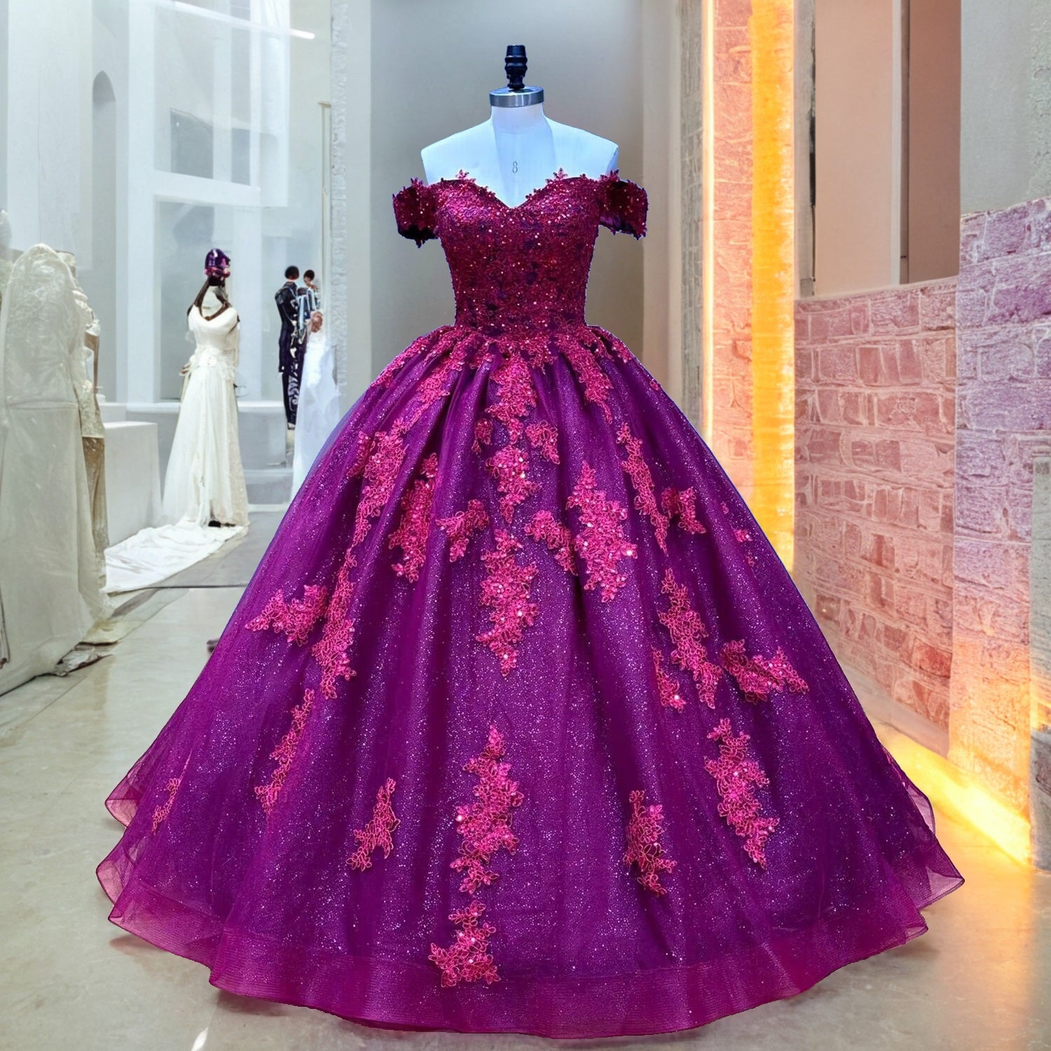 Full front view of the off-the-shoulder burgundy quinceanera ball gown with intricate floral lace appliques displayed on a mannequin in a showroom hallway.