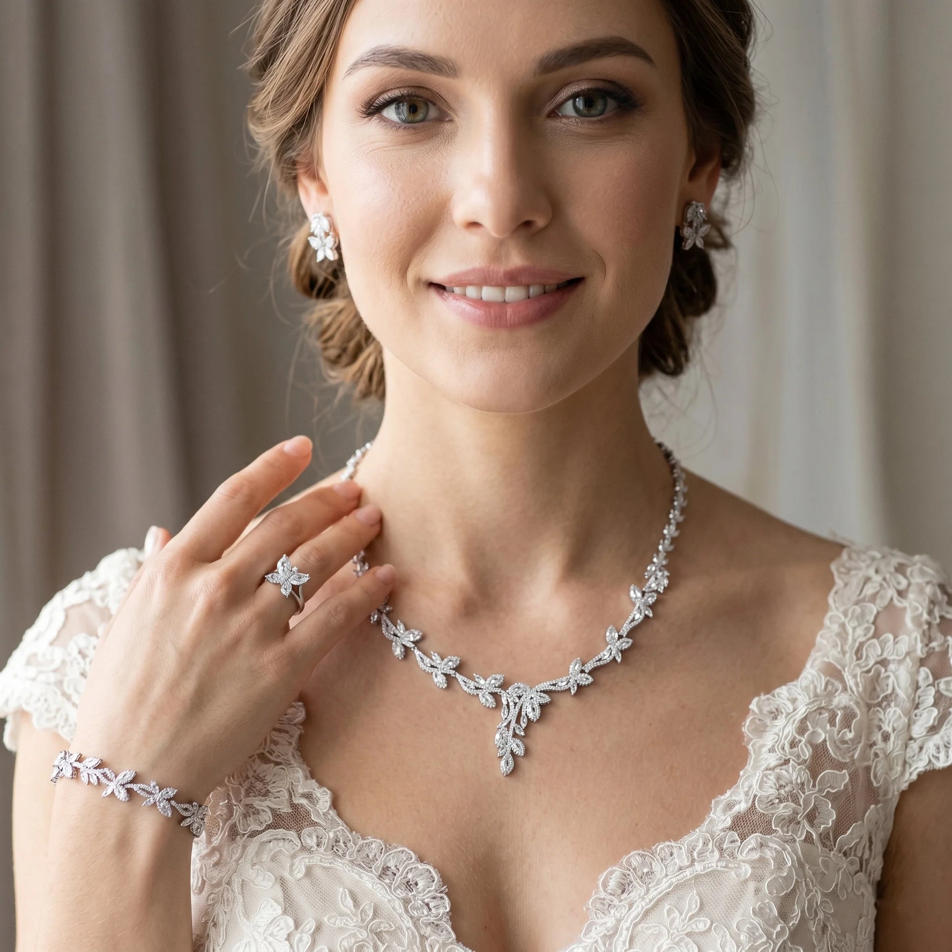 Smiling model wearing a trendy luxury 4PCS zirconia wedding jewelry set with a Dubai-inspired branch necklace, bracelet, butterfly ring, and earrings.