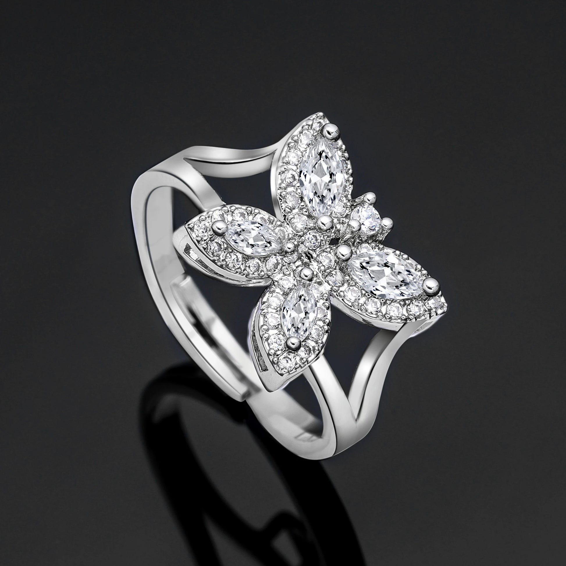 High-resolution product shot of a silver cubic zirconia butterfly statement ring from a luxury bridal party accessory collection.
