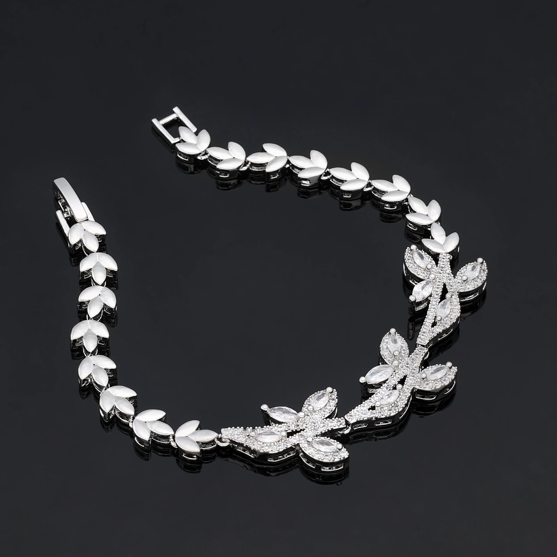Detailed flat lay of a luxury silver branch wedding bracelet with a folding clasp from a 4PCS bridal accessory collection.