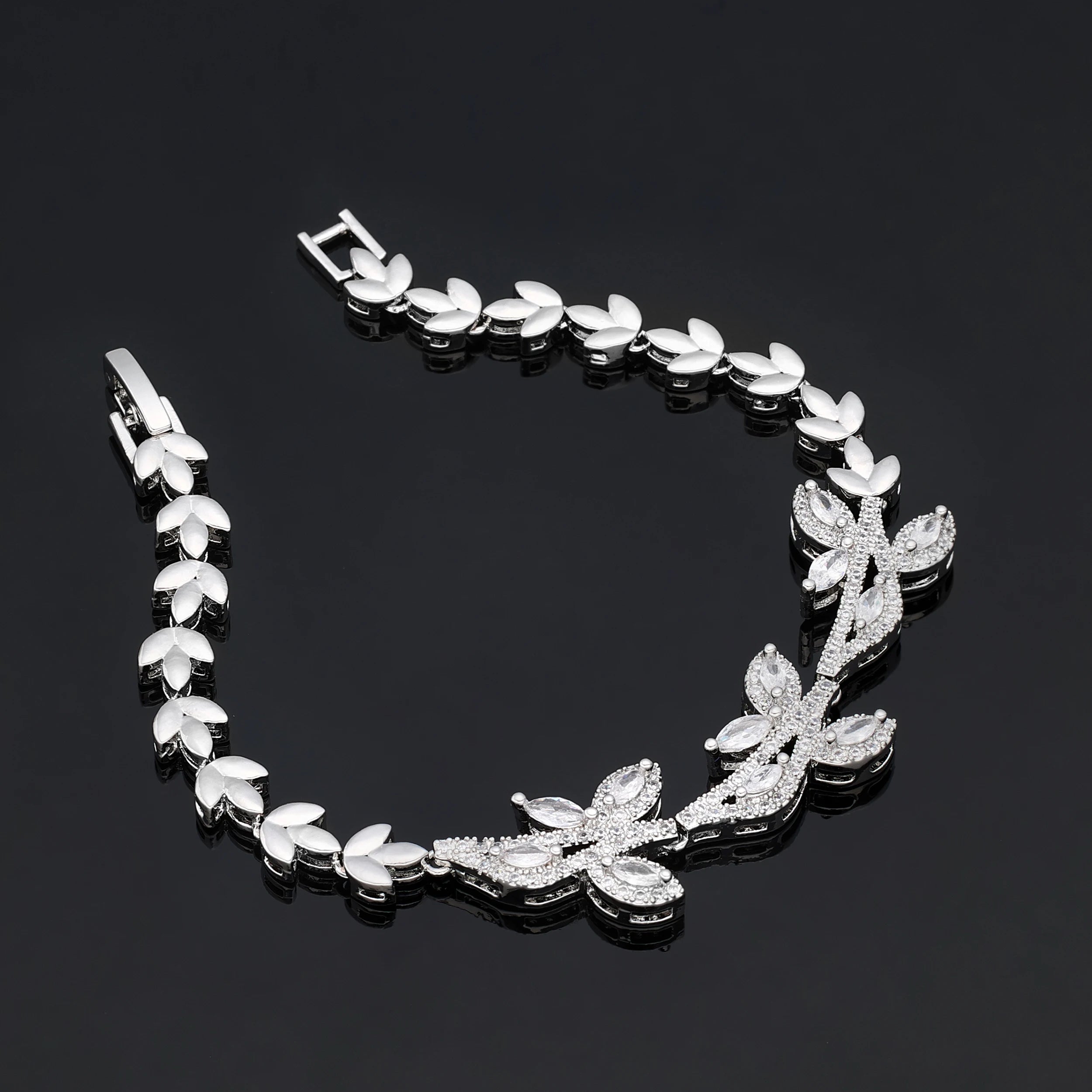 Detailed flat lay of a luxury silver branch wedding bracelet with a folding clasp from a 4PCS bridal accessory collection.