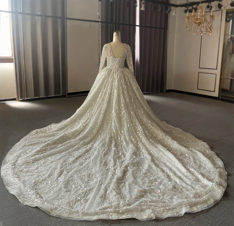 Three-quarter back angle of the sparkly mermaid wedding gown, highlighting the high-fashion fit-and-flare design and premium heavy beading craftsmanship.