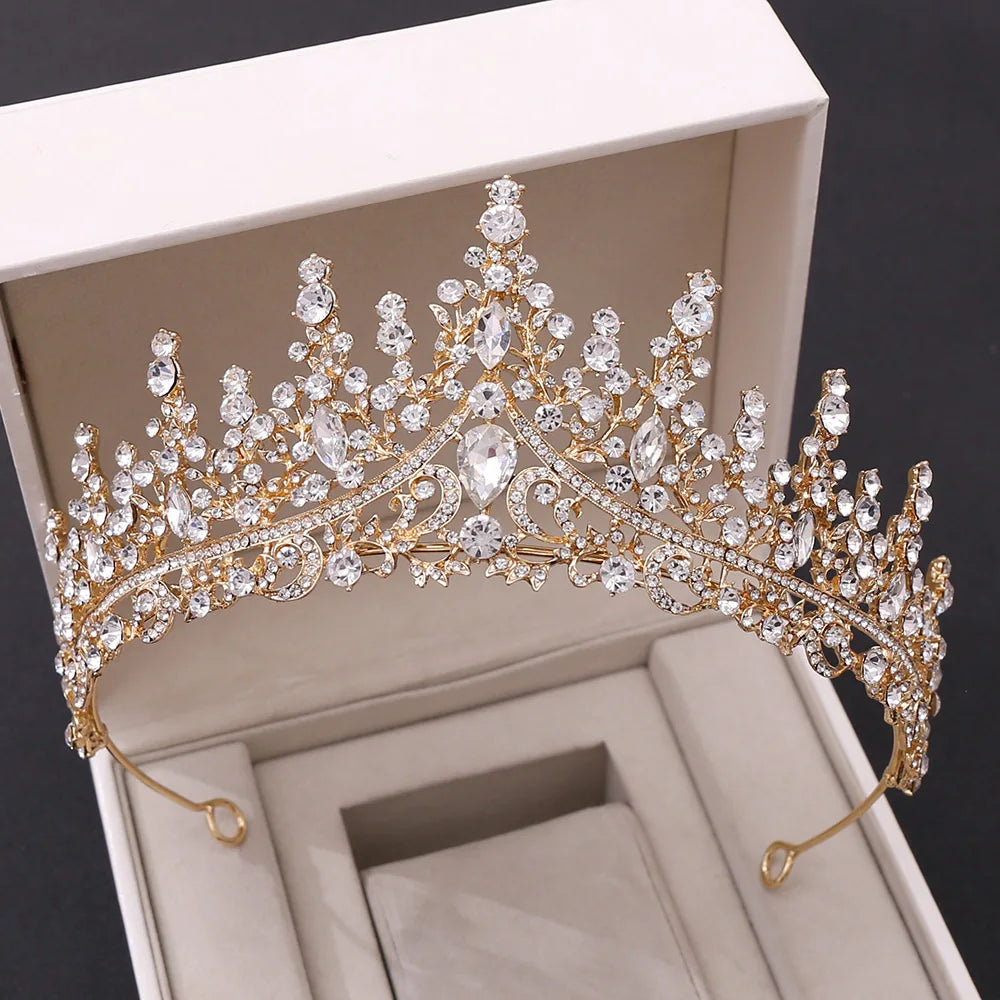 A classic gold-tone bridal diadem crown covered in clear sparkling crystals, perfect for a vintage-inspired wedding.