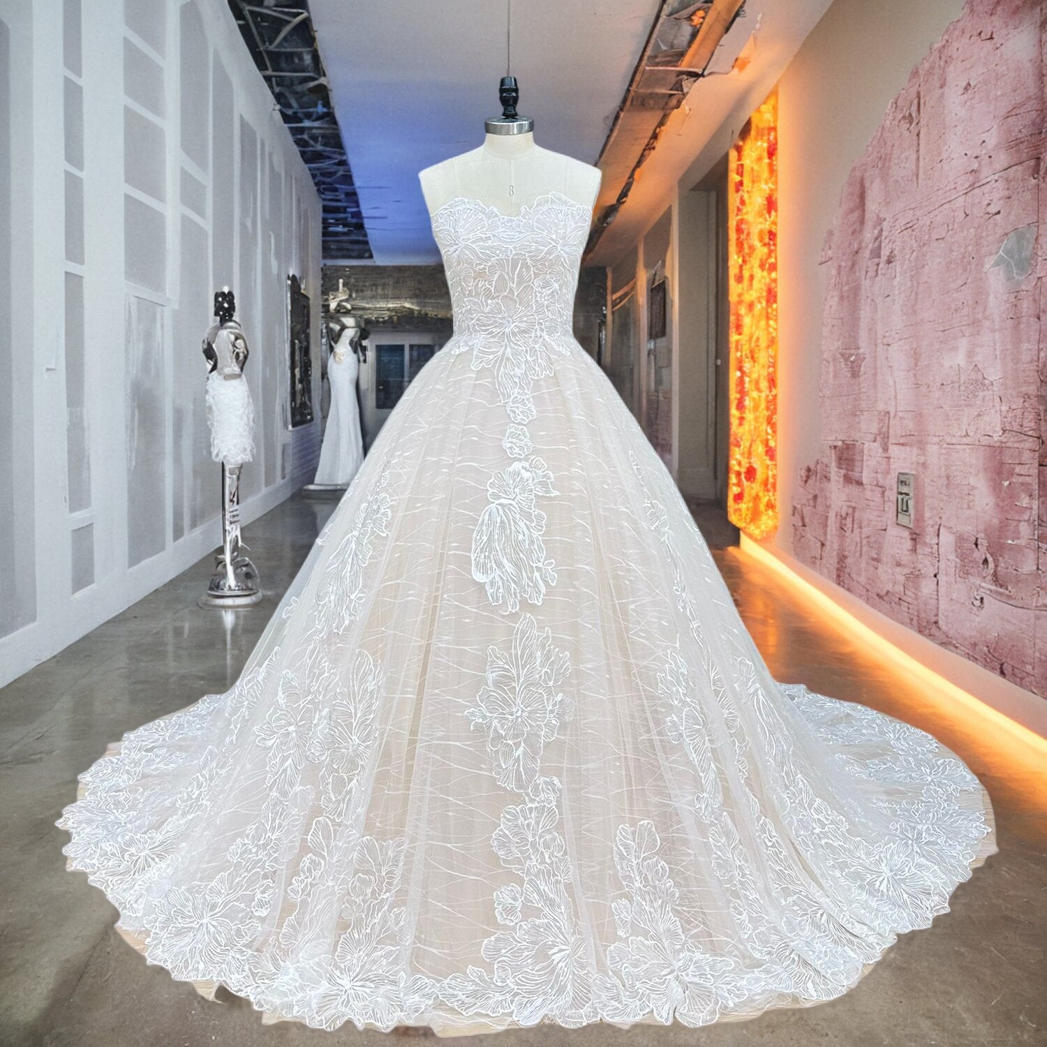 Premium strapless sweetheart lace ball gown bridal gown with shimmering silver sequined appliques displayed on a mannequin in a boutique hallway.