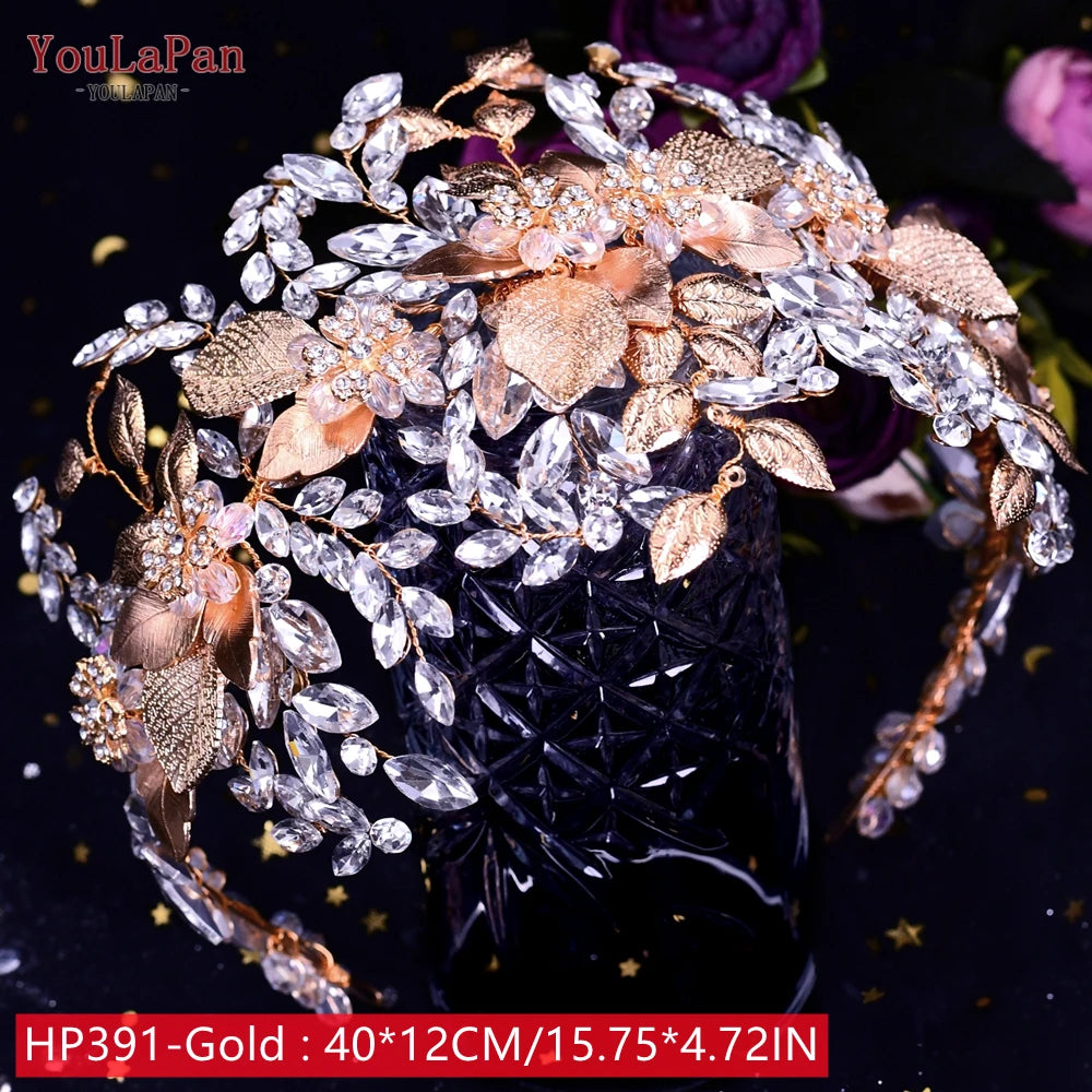 Close-up view of a luxury rose gold bridal headpiece showing a mix of smooth metallic leaves, pave crystal foliage, and pink enamel accents.