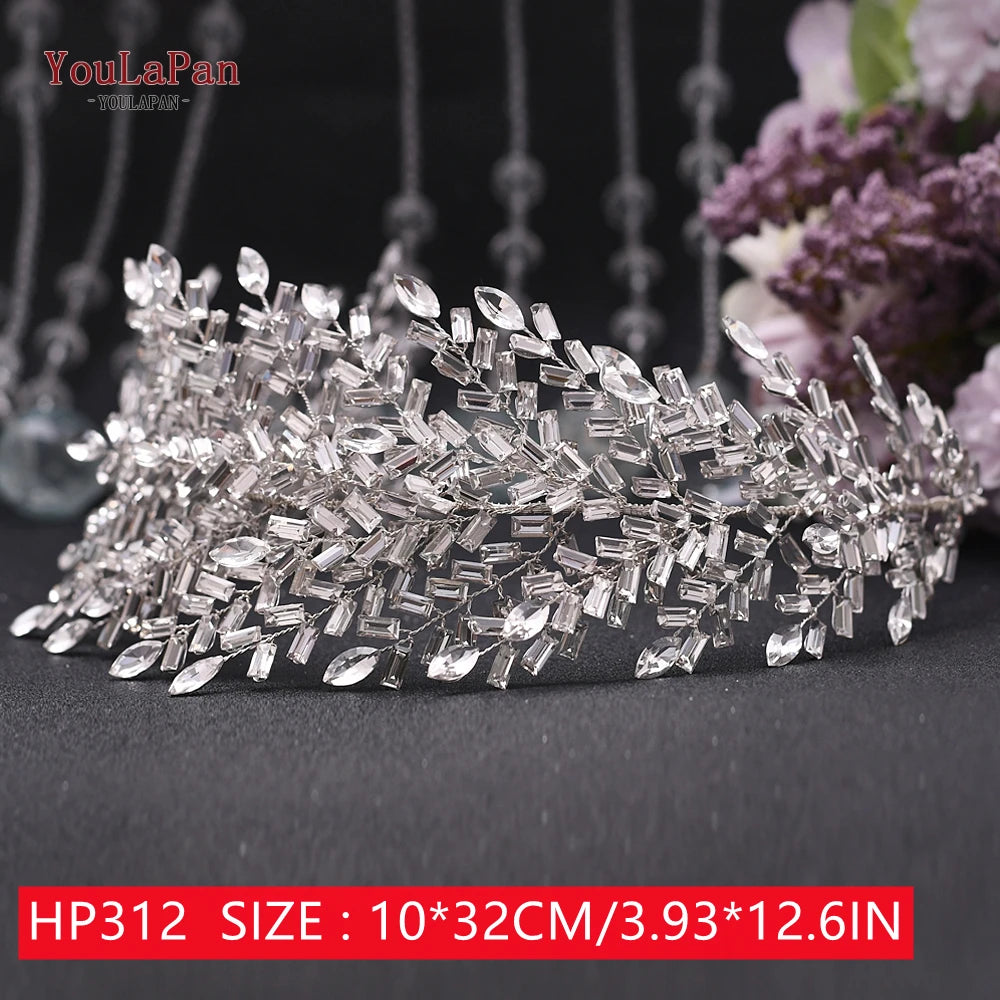 Flexible silver crystal bridal hair vine with a multi-layered design of marquise stone leaves, showcased on a black dome structure measuring 44 by 10 centimeters.