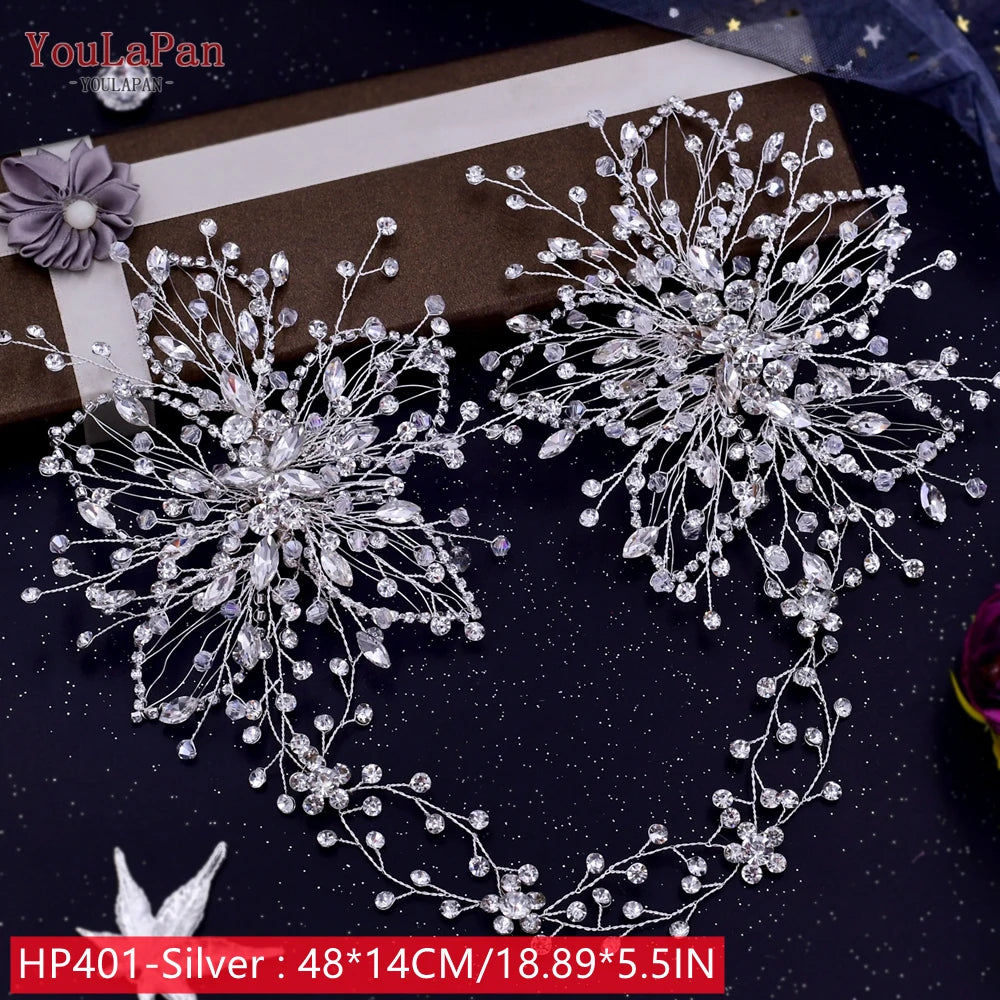 Wide flat lay view of the long HP401 silver rhinestone bridal hair vine, detailed with twin large crystal floral endpiece plaques measuring 48 by 14 centimeters.